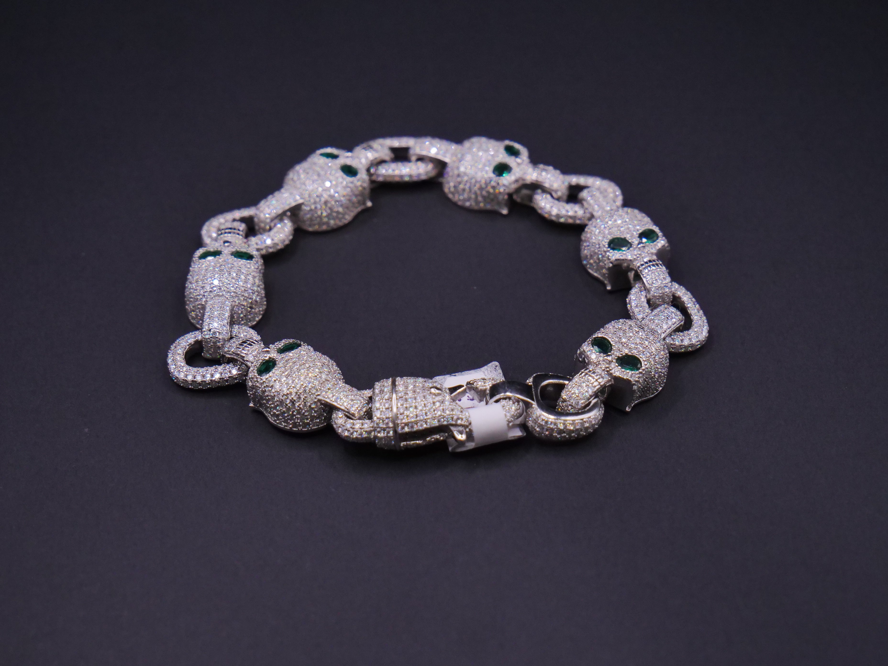 Iced Out Skull Link Bracelet In Silver With Full Pavé CZ & Emerald Eyes