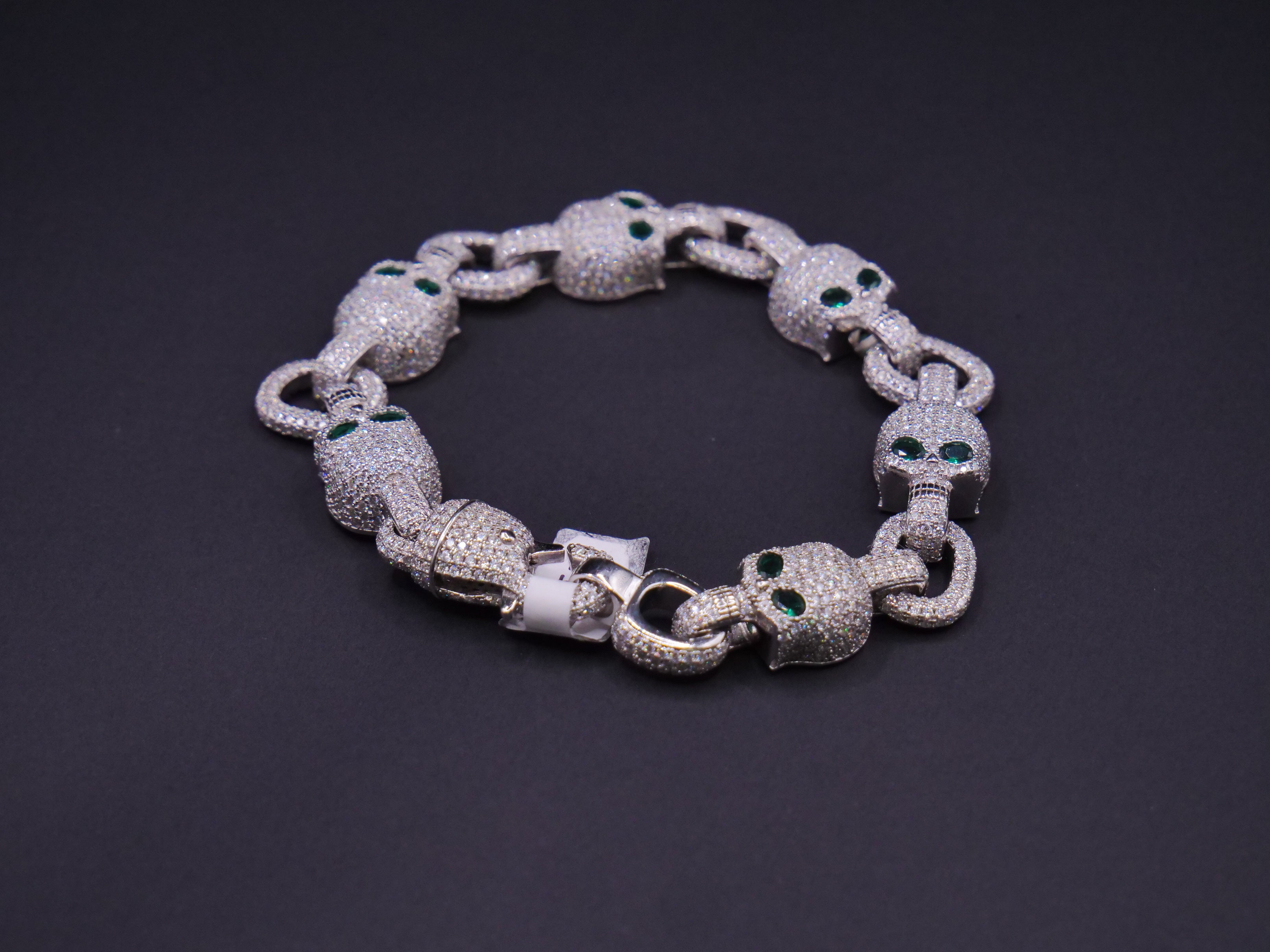 Iced Out Skull Link Bracelet In Silver With Full Pavé CZ & Emerald Eyes