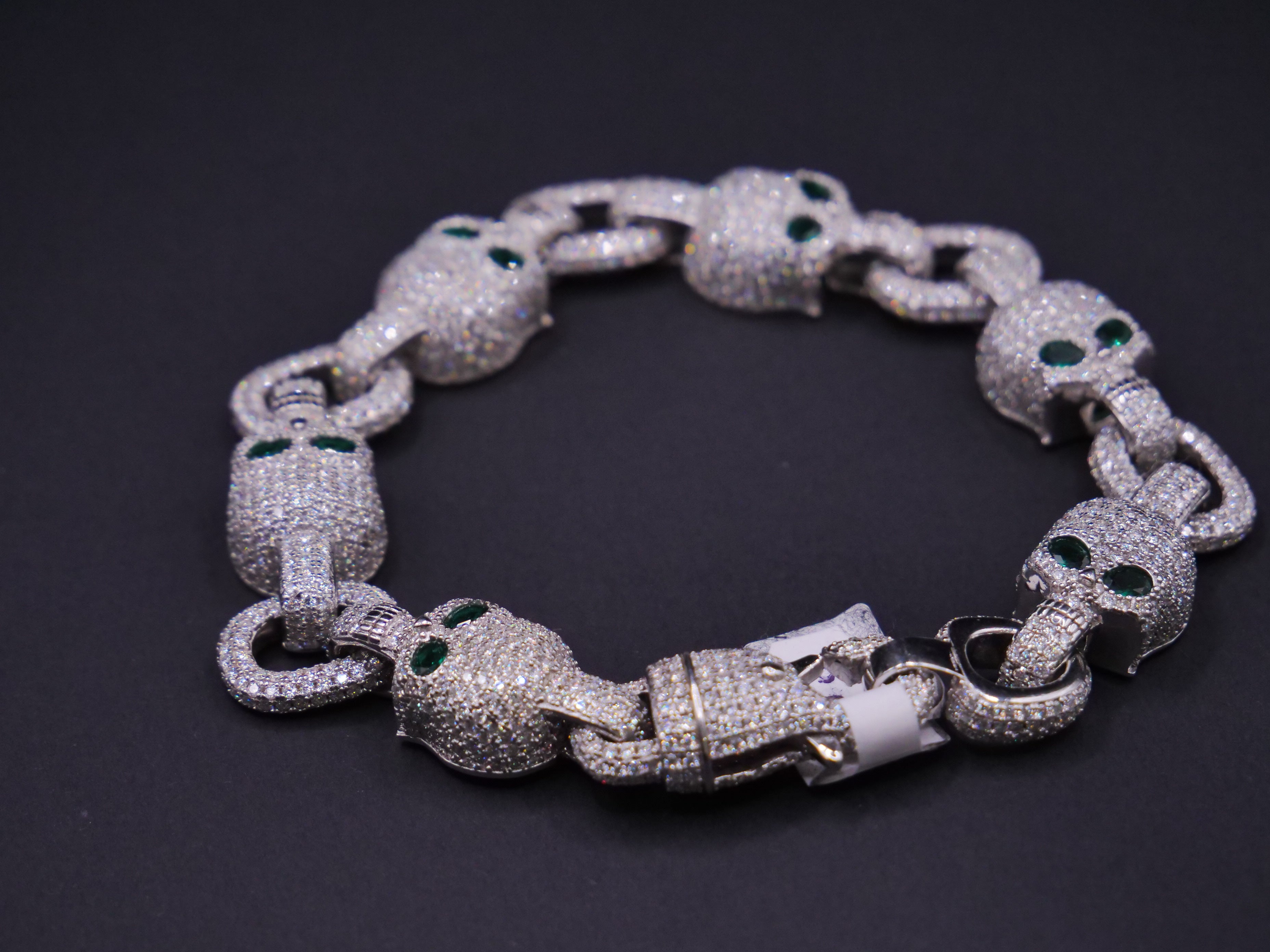 Iced Out Skull Link Bracelet In Silver With Full Pavé CZ & Emerald Eyes