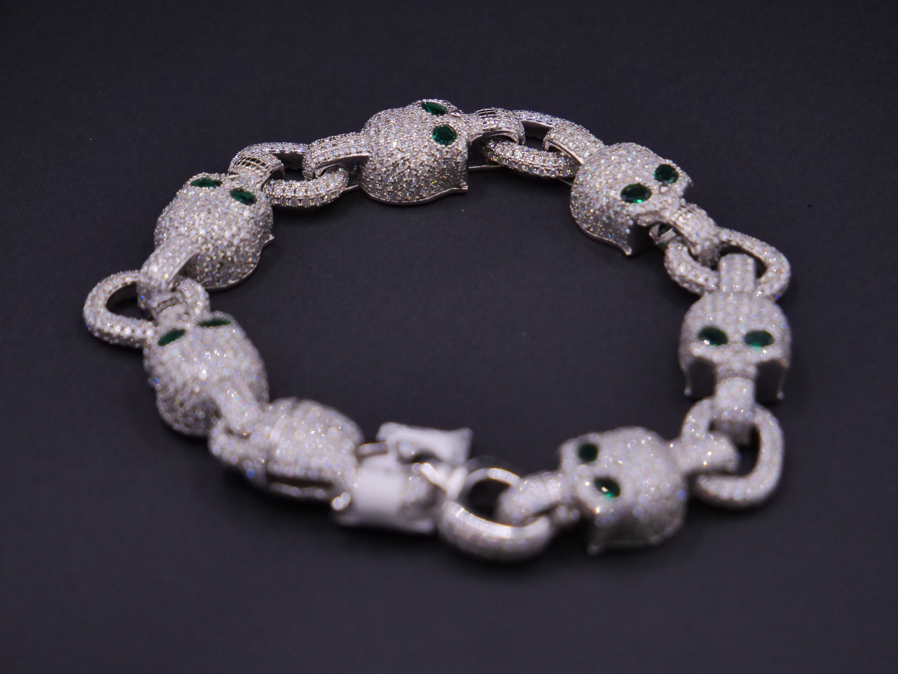 Iced Out Skull Link Bracelet In Silver With Full Pavé CZ & Emerald Eyes