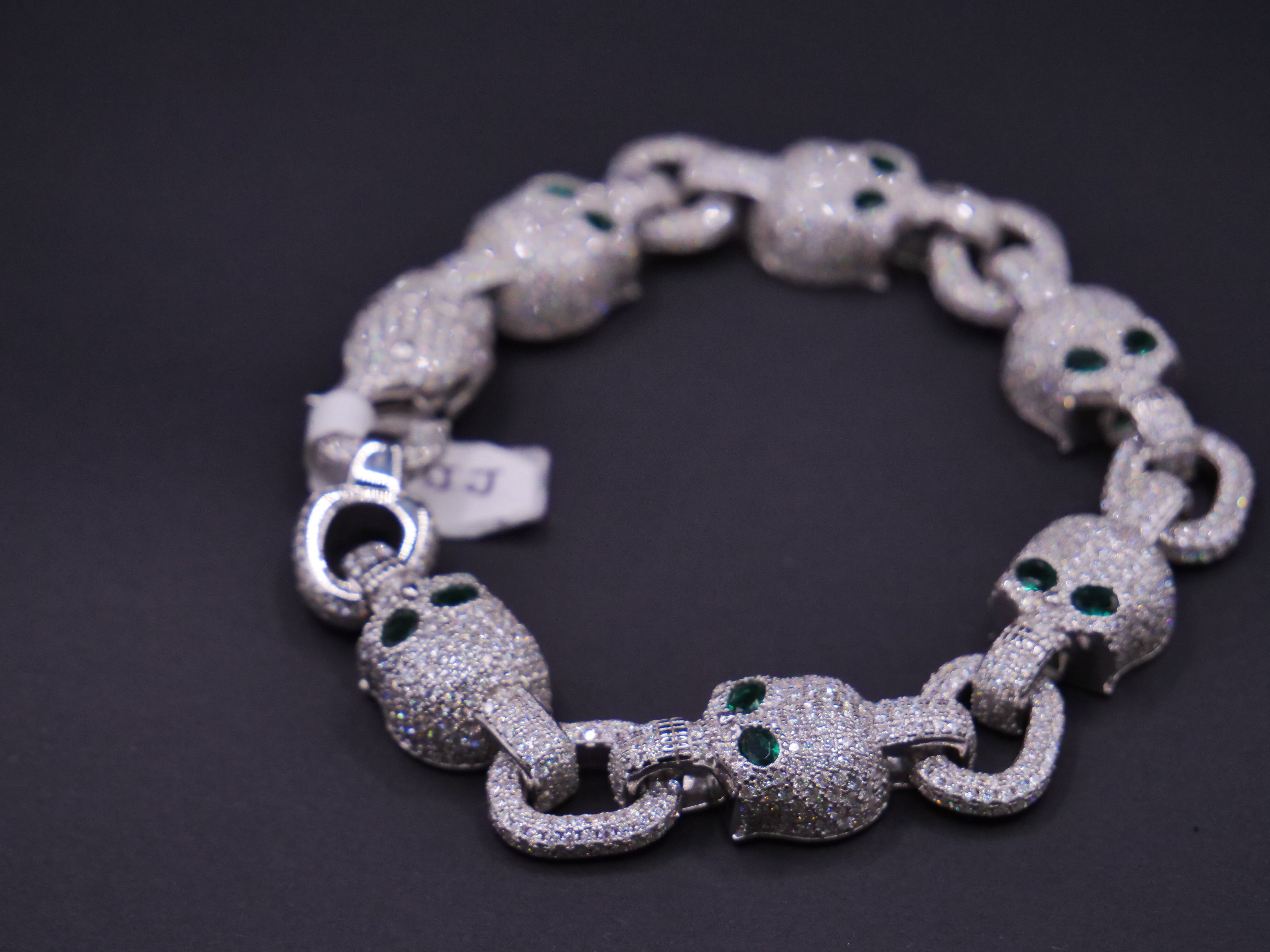 Iced Out Skull Link Bracelet In Silver With Full Pavé CZ & Emerald Eyes