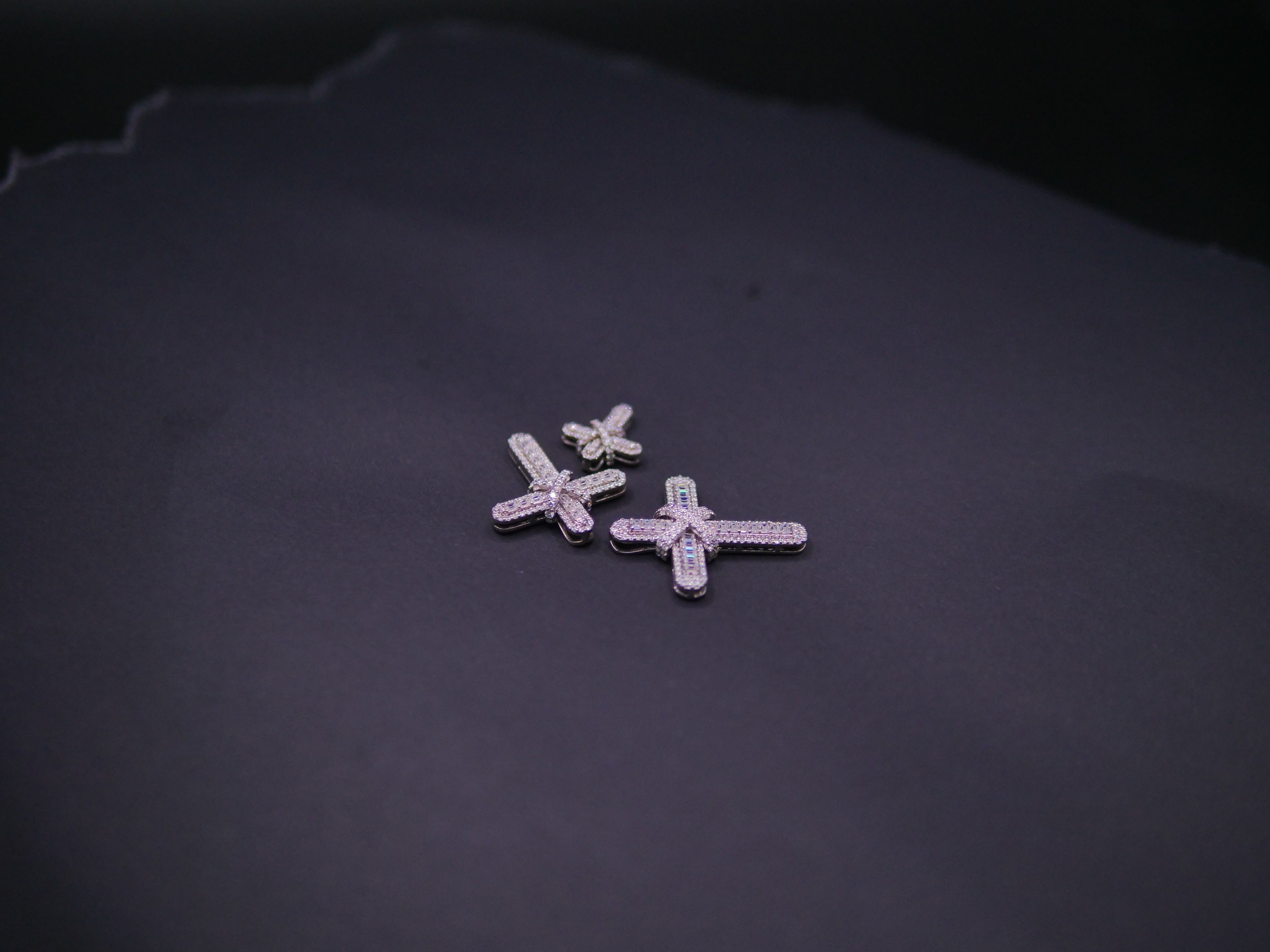 Pavé Diamond Bow-Tied Cross Pendant In White Gold