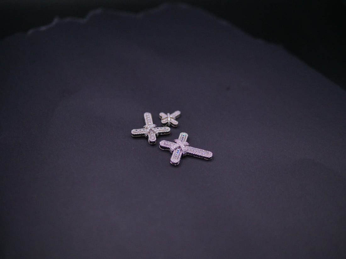 Pavé Diamond Bow-Tied Cross Pendant In White Gold