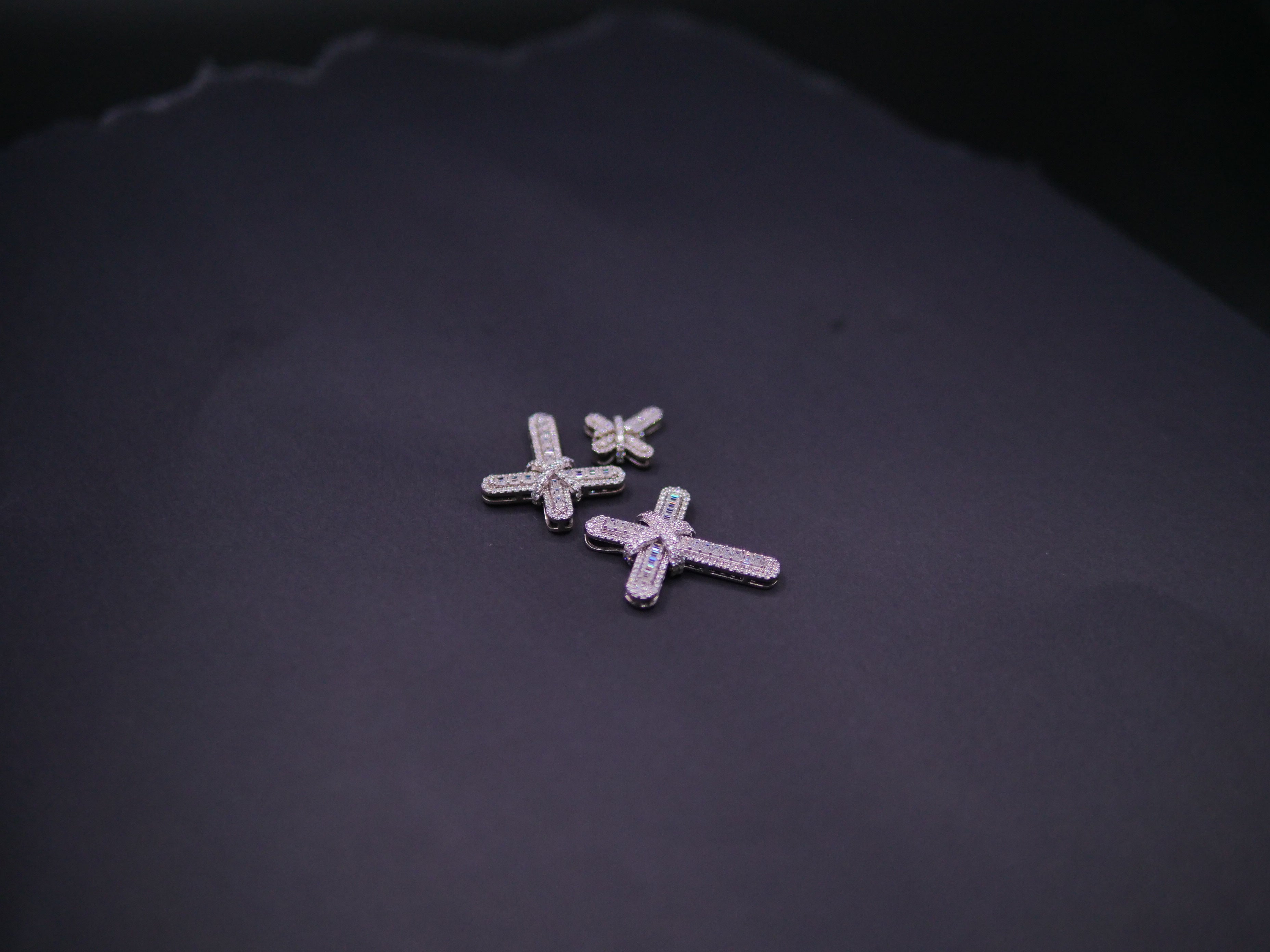 Pavé Diamond Bow-Tied Cross Pendant In White Gold