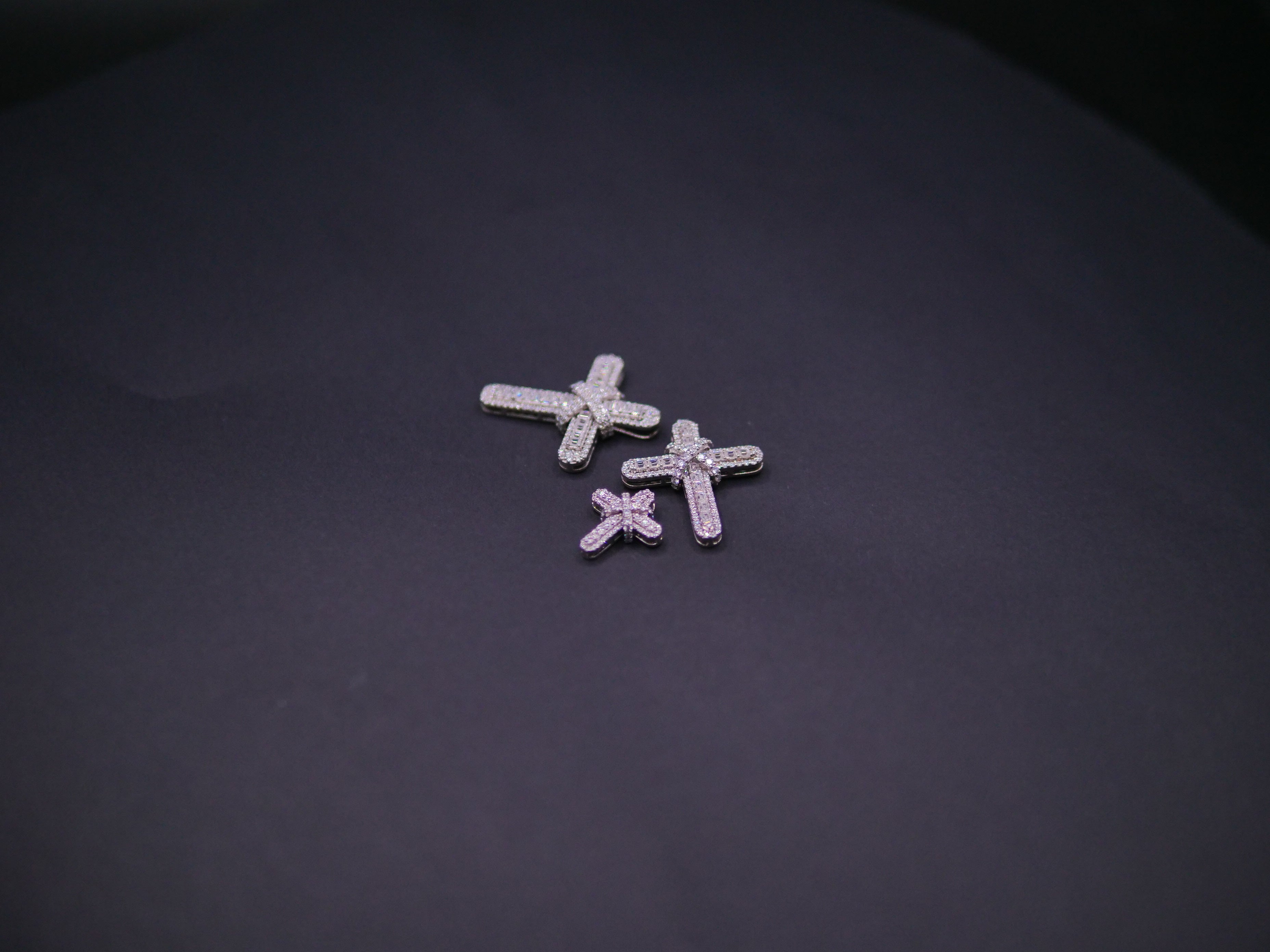 Pavé Diamond Bow-Tied Cross Pendant In White Gold