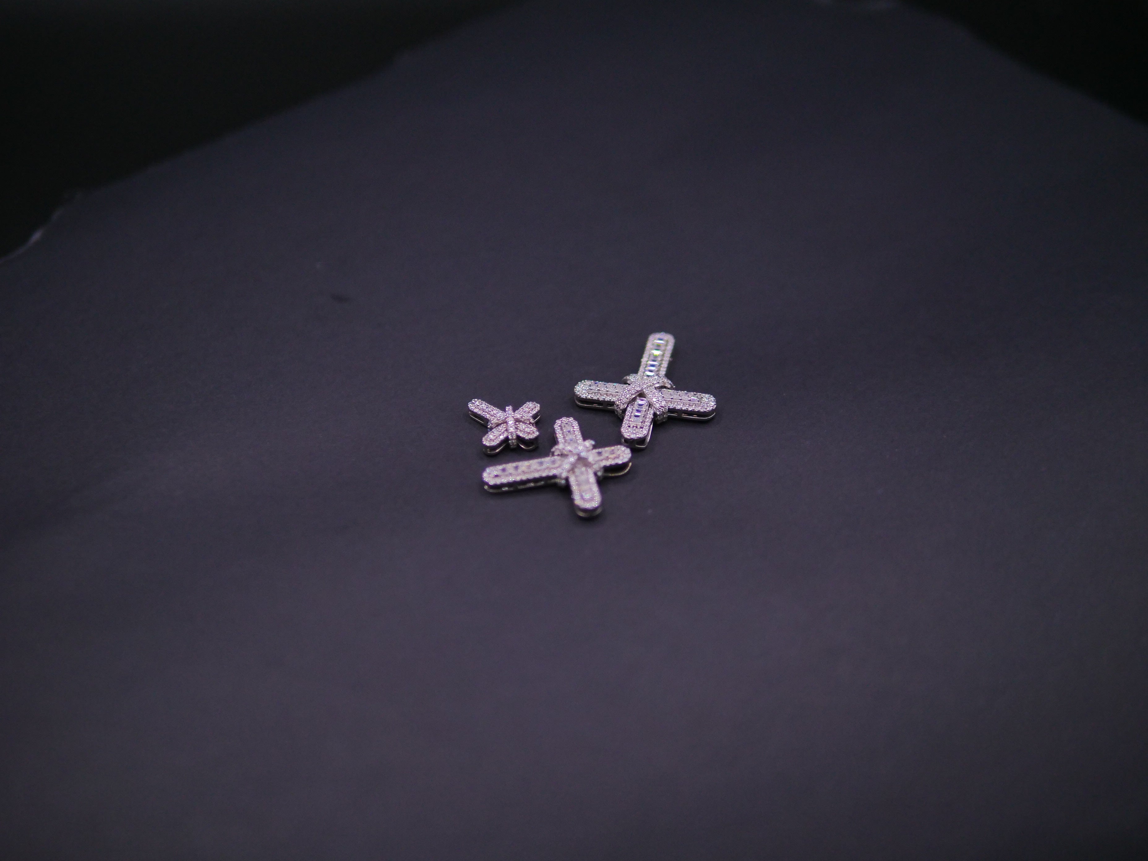 Pavé Diamond Bow-Tied Cross Pendant In White Gold