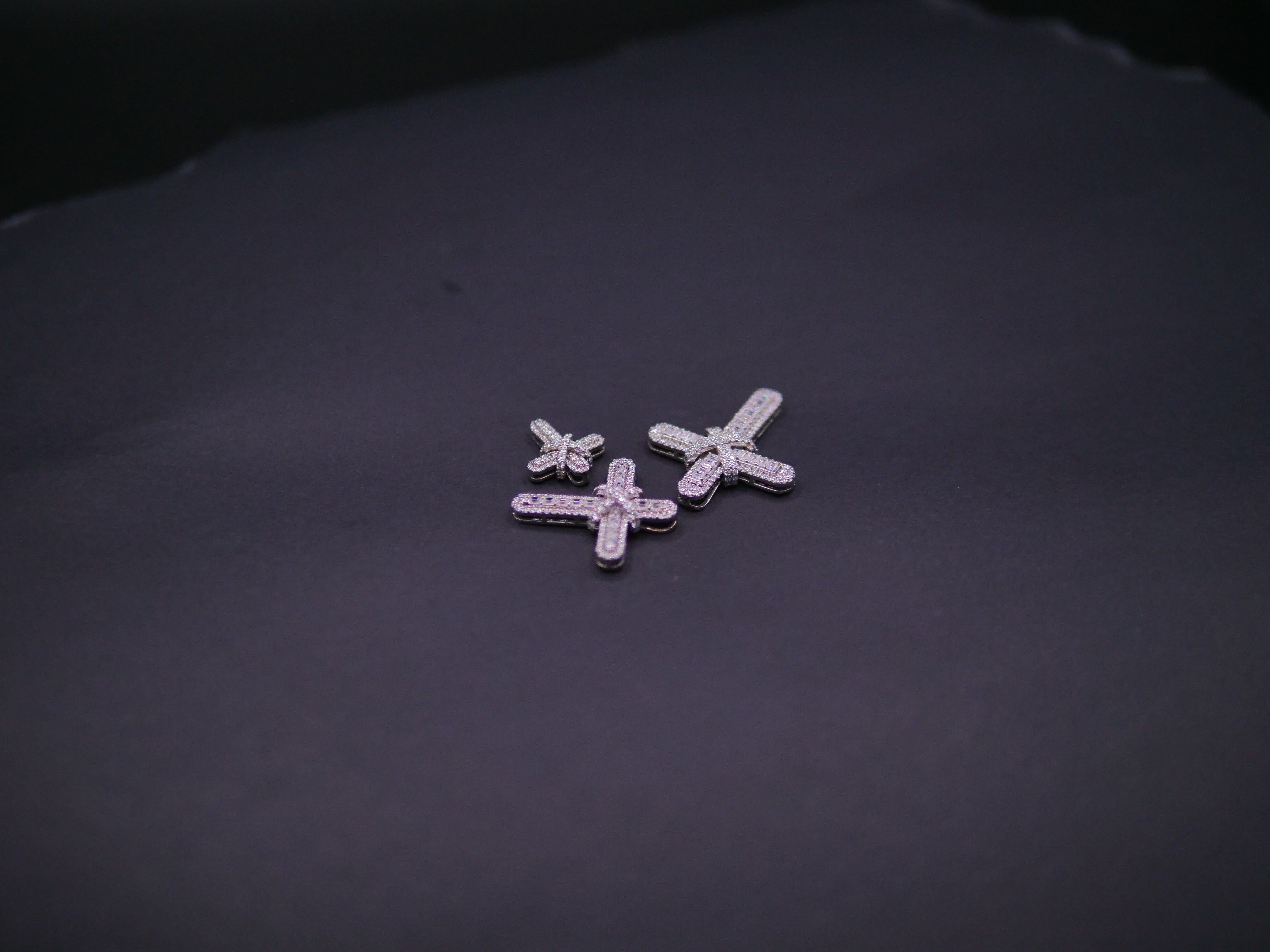 Pavé Diamond Bow-Tied Cross Pendant In White Gold