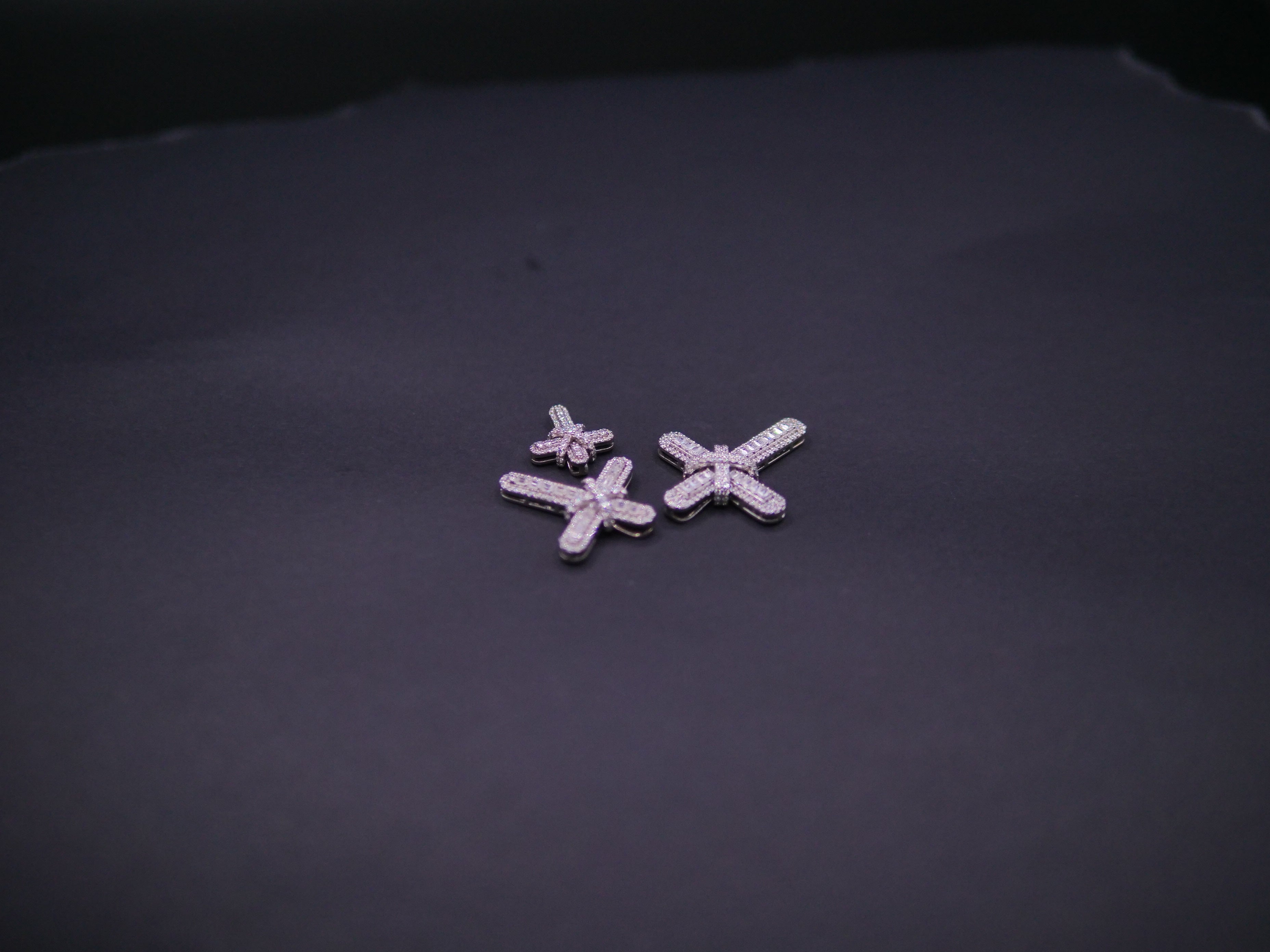 Pavé Diamond Bow-Tied Cross Pendant In White Gold