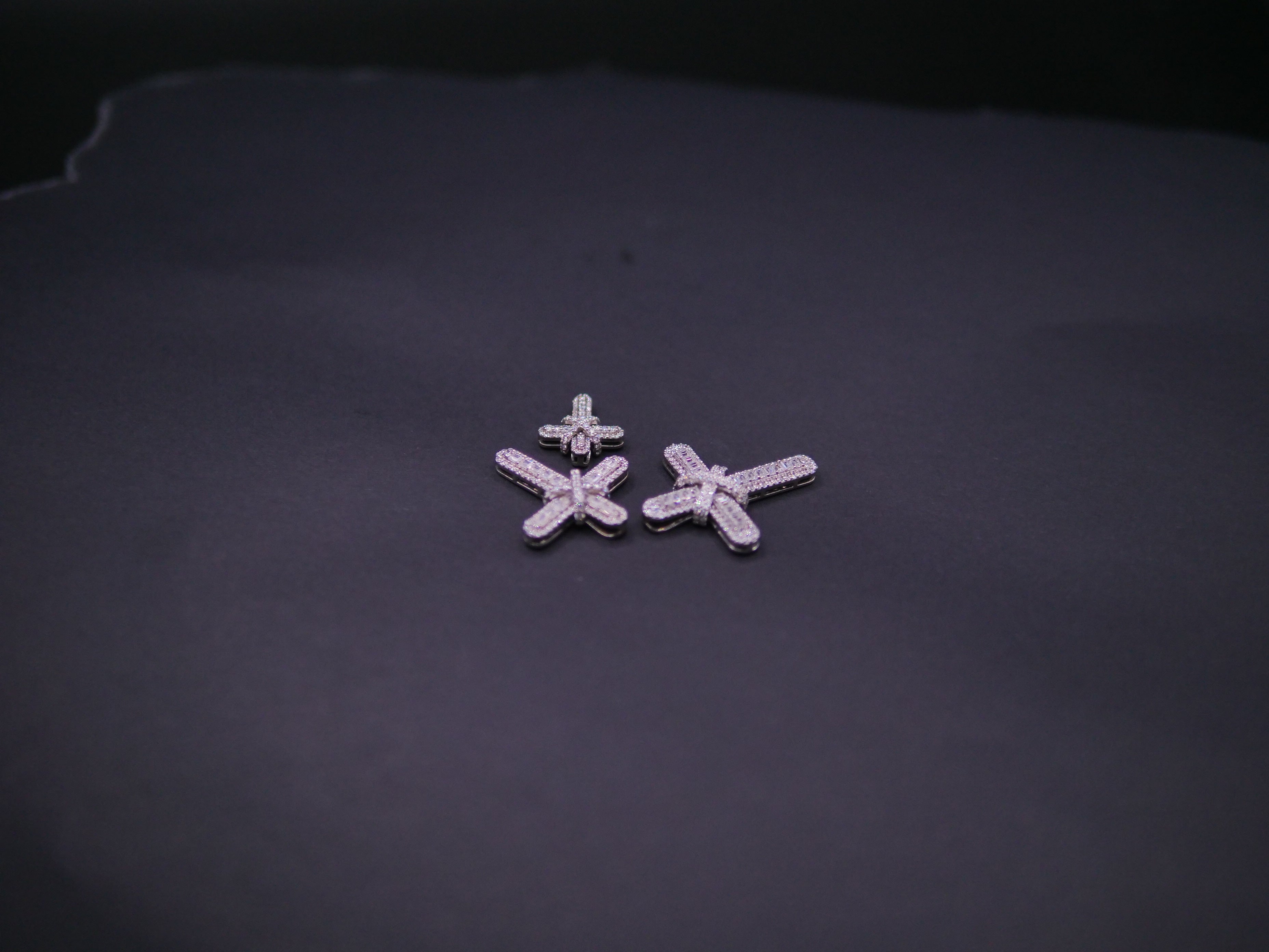 Pavé Diamond Bow-Tied Cross Pendant In White Gold